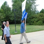 faculty following the banner